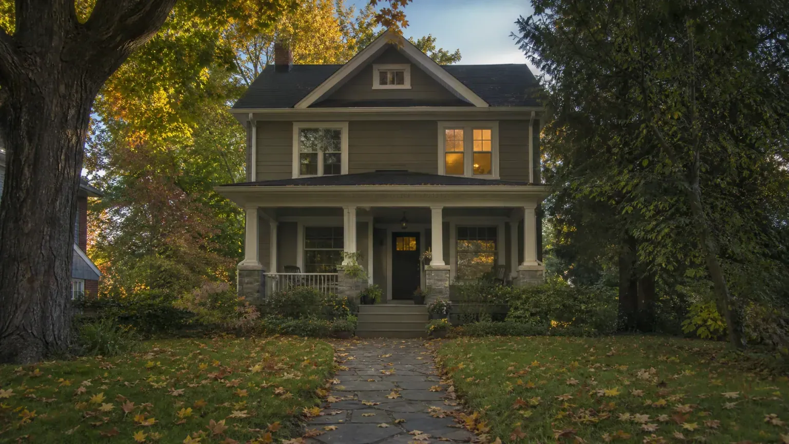 A classic Canadian family home on a tree-lined street in early autumn — the home heirs of a reverse mortgage borrower decide to keep or sell